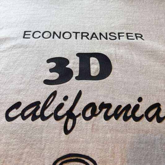 Raised 3D heat transfer vinyl applied on custom apparel showing thick textured logo effect and professional finish